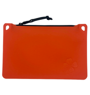A bright orange silicone pouch with a black zipper and a small embossed four-leaf clover logo in the bottom right corner, shown on a plain white background.