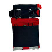 A medical emergency kit pouch with a black and red design, featuring a waist strap, tourniquet, and gauze packets, shown against a plain white background.
