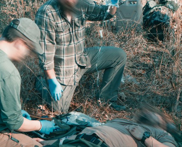 Two field experienced subject matter experts rendering care in an austere environment